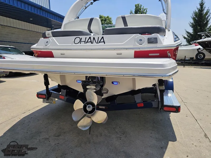 Slide: The Image of 2018 Regal 2300 Bowrider boat on trailer, rear view with propeller and "OHANA" text. - 31