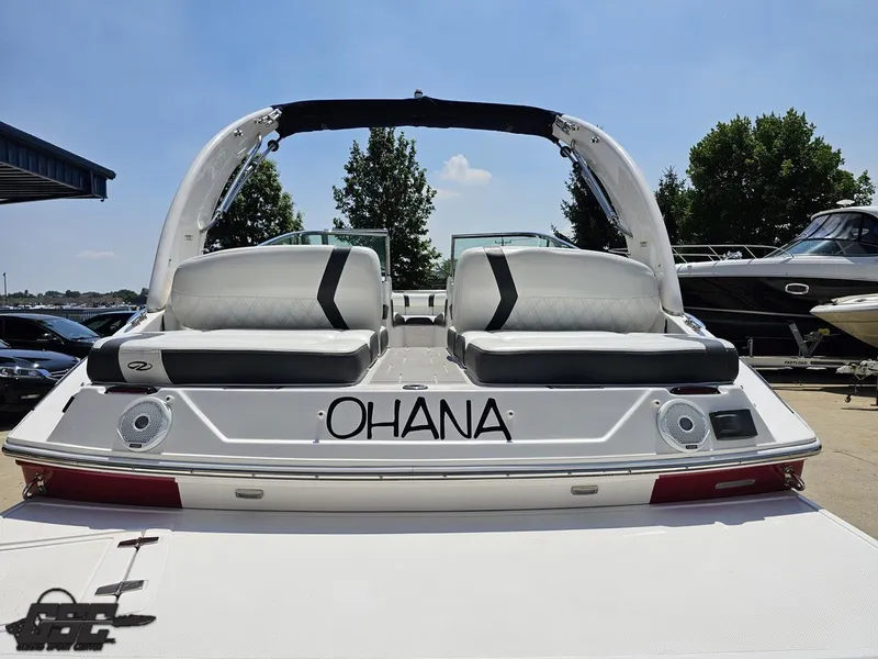 Slide: The Image of 2018 Regal 2300 Bowrider boat with "OHANA" text, docked under clear sky. - 35