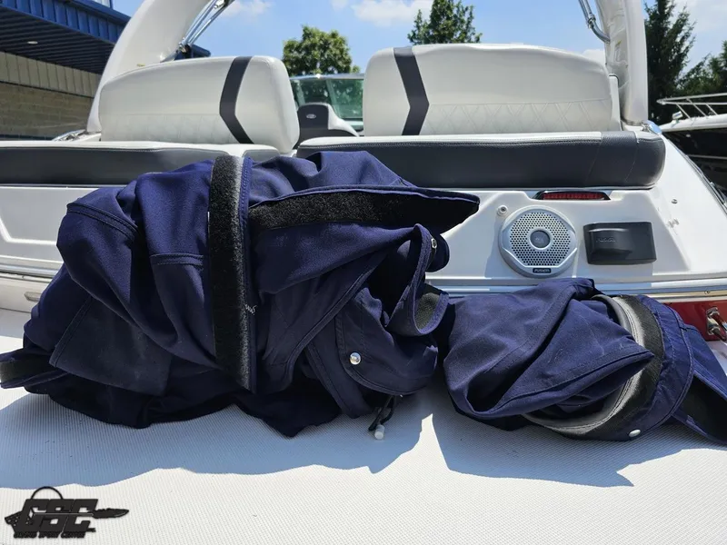 Slide: The Image of 2018 Regal 2300 Bowrider interior with navy covers and speaker detail. - 38
