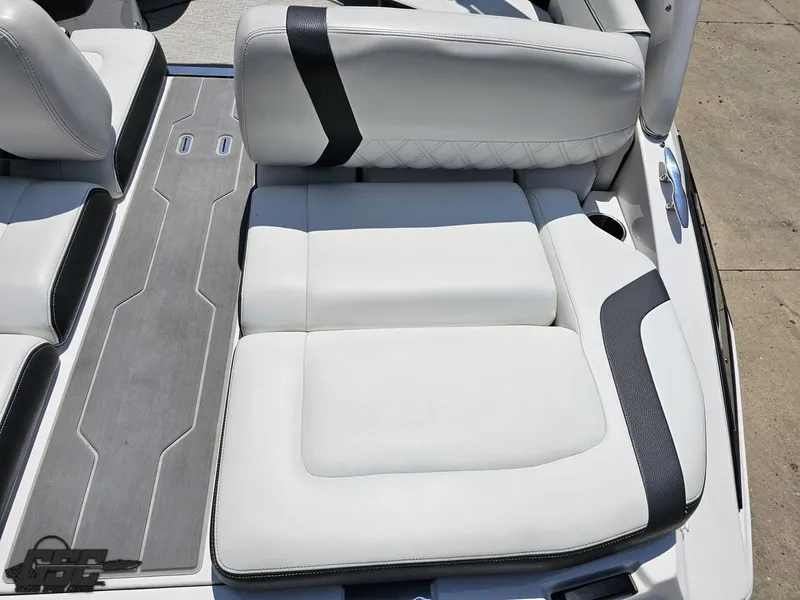 Slide: The Image of 2018 Regal 2300 Bowrider boat interior with white and black seating. - 44
