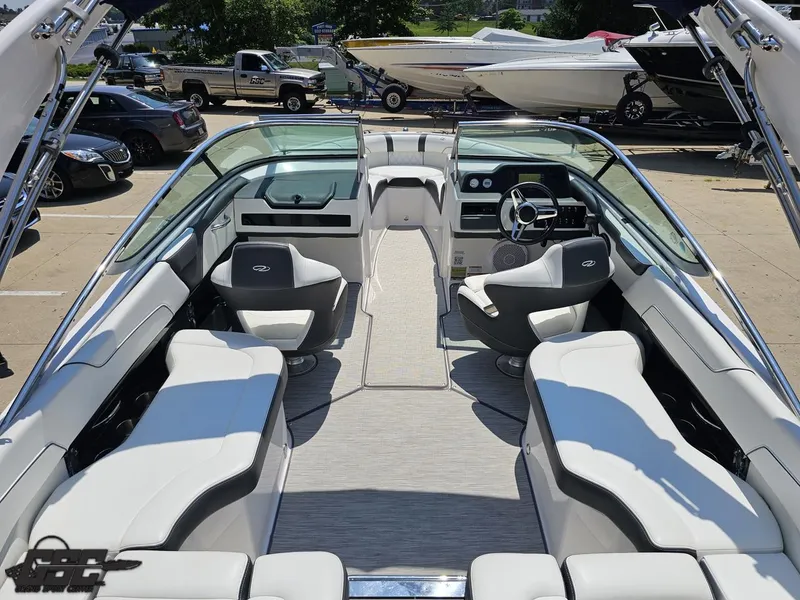 Slide: The Image of 2018 Regal 2300 Bowrider boat interior with white seating and modern dashboard. - 48