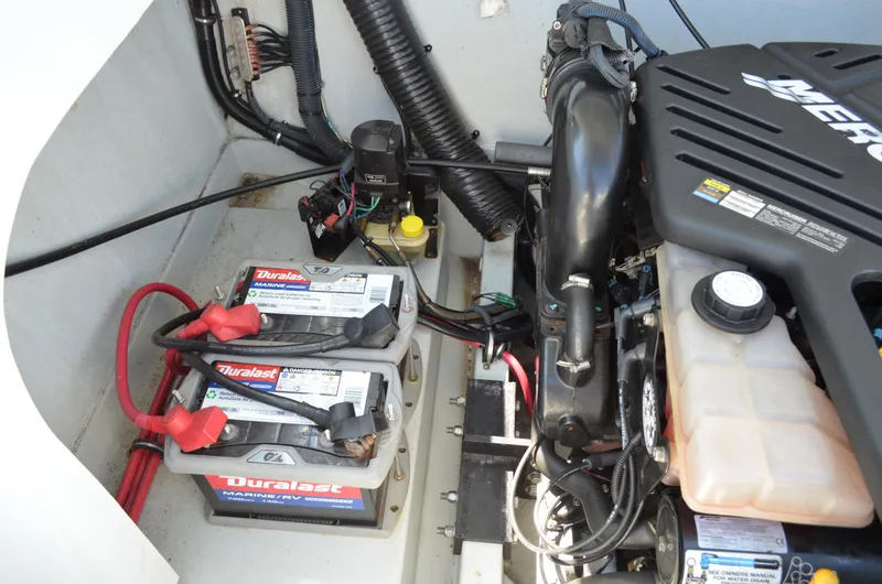 Slide: The Image of Engine compartment of 2008 Baja 26 Outlaw with Duralast marine batteries. - 12
