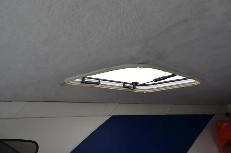 Slide: The Image of Interior view of 2008 Baja 26 Outlaw boat cabin with open hatch. - 29