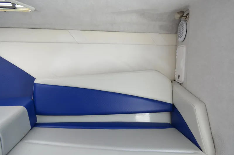 Slide: The Image of Interior of 2008 Baja 26 Outlaw boat with blue and white seating. - 30