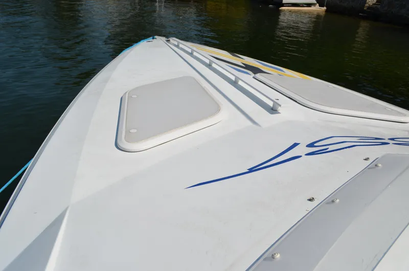 Slide: The Image of 2008 Baja 26 Outlaw boat deck with sleek design and blue graphics. - 5
