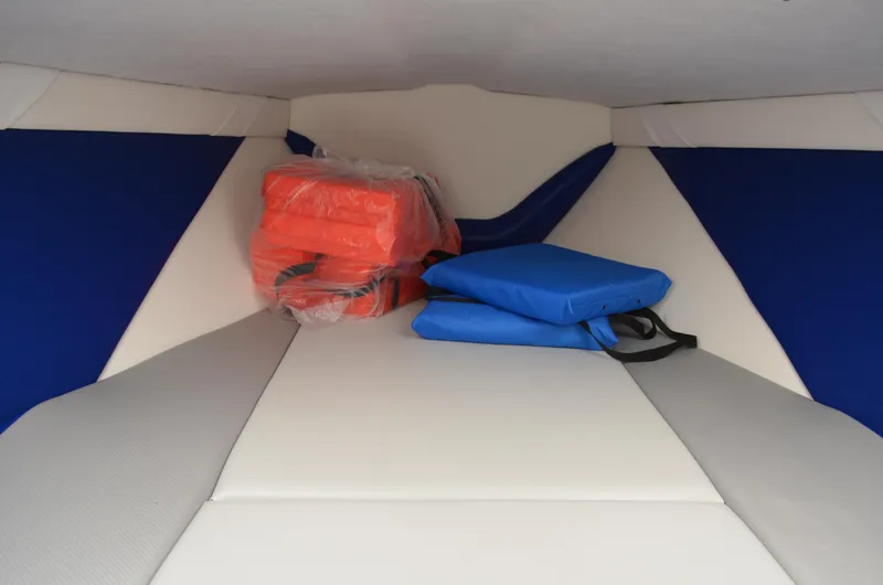 Slide: The Image of Interior of 2008 Baja 26 Outlaw boat with life jackets and cushions. - 28