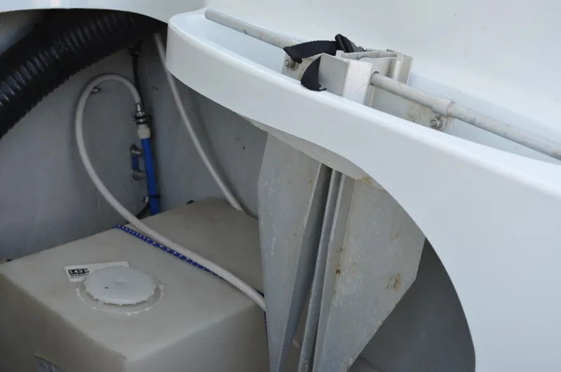 Slide: The Image of 2008 Baja 26 Outlaw boat interior showing storage compartment and equipment. - 16