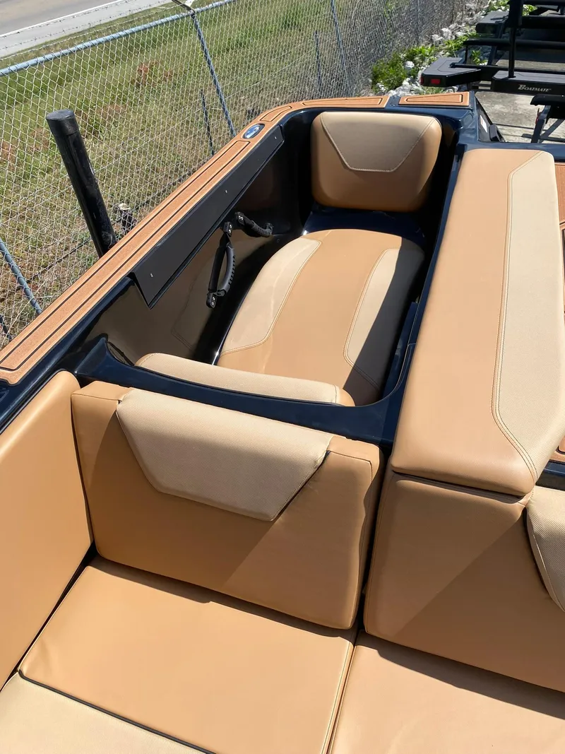 Slide: The Image of 2025 Heyday WT-2DC boat interior with tan seating and sleek design. - 16