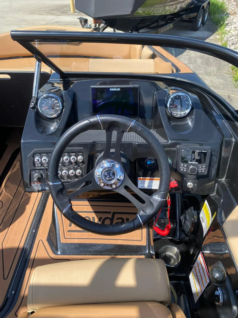 Slide: The Image of Steering console of 2025 Heyday WT-2DC boat with gauges and controls. - 18