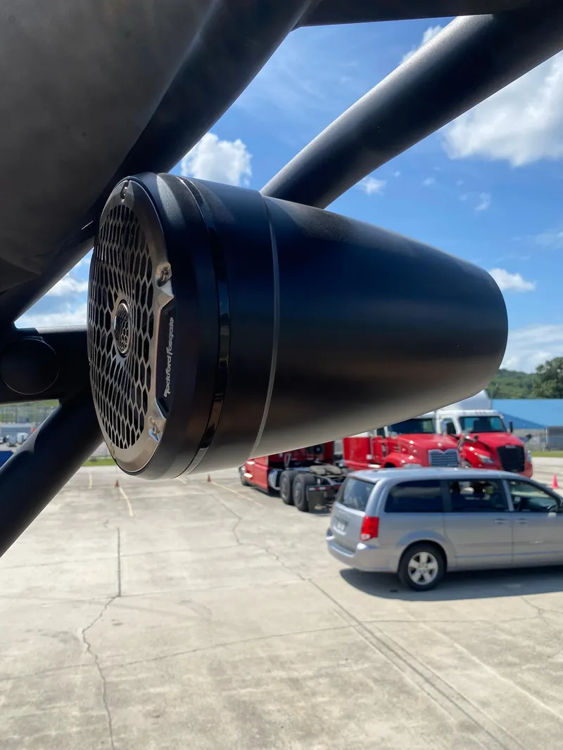 Slide: The Image of Close-up of Heyday WT-2DC 2025 speaker on a vehicle, with trucks in the background. - 19