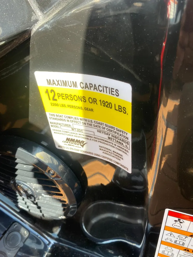 Slide: The Image of Label on Heyday WT-2DC boat showing maximum capacity of 12 persons or 1920 lbs. - 20