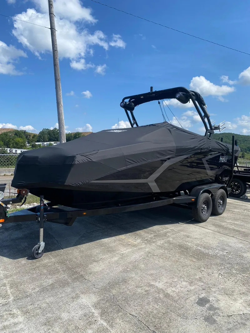 Slide: The Image of 2025 Heyday WT-2DC boat covered on trailer under blue sky. - 21
