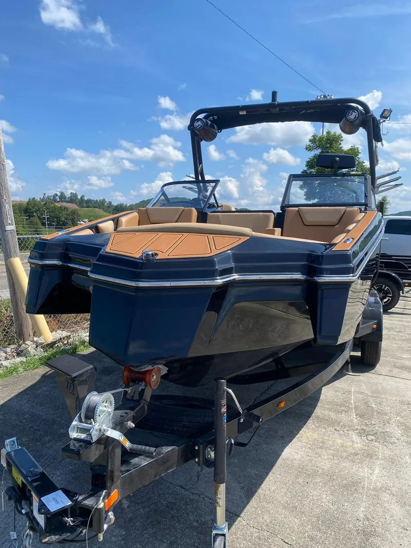 Slide: The Image of 2025 Heyday WT-2DC boat on trailer under clear blue sky. - 4