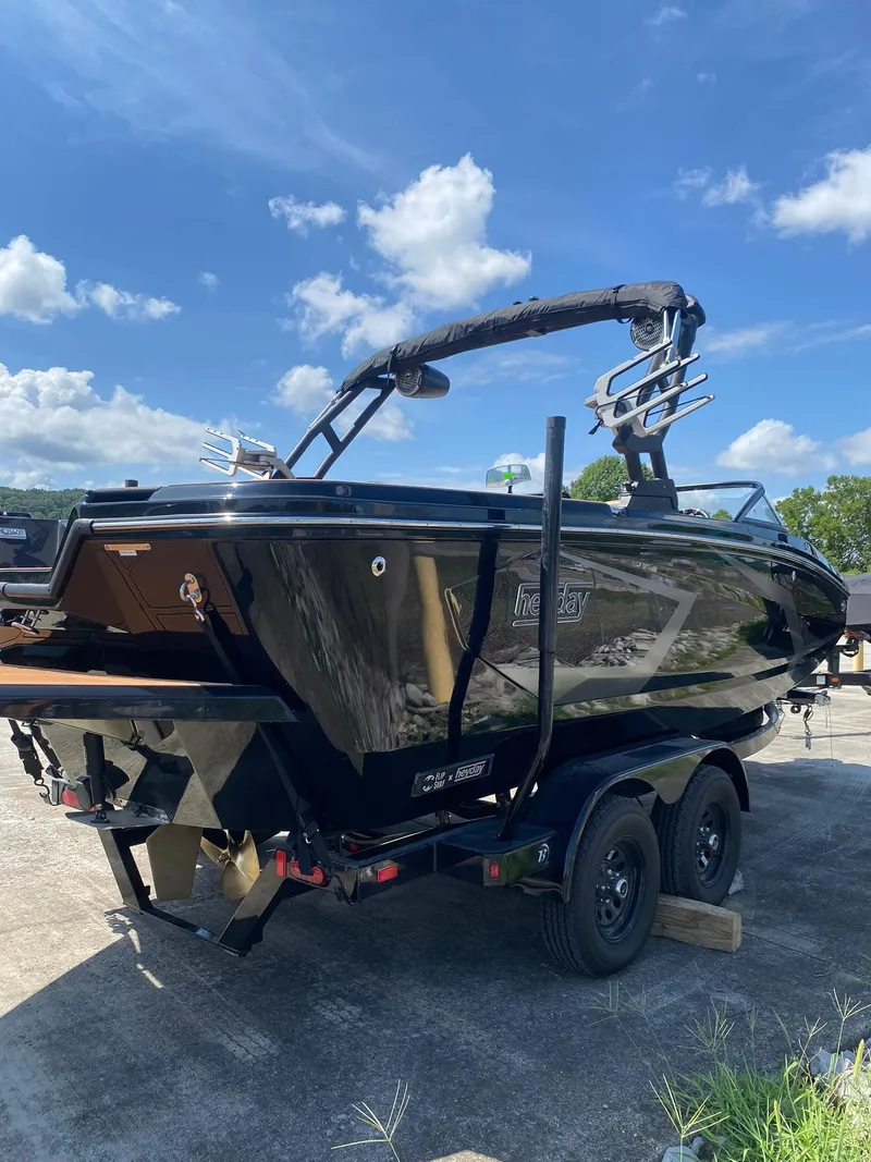 Slide: The Image of 2025 Heyday WT-2DC boat on trailer under blue sky. - 7