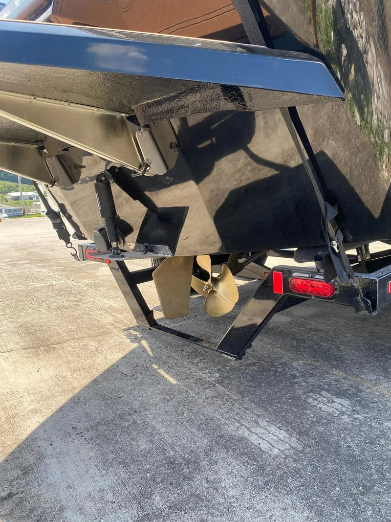 Slide: The Image of Heyday WT-2DC 2025 boat stern with propeller and trim tabs on trailer. - 8