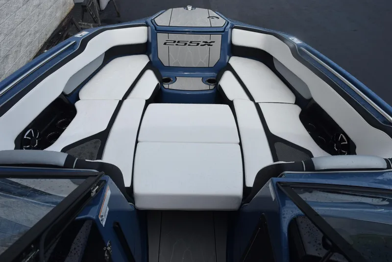 Slide: The Image of 2023 Yamaha Boats 255XD interior with white cushioned seating and sleek design. - 17
