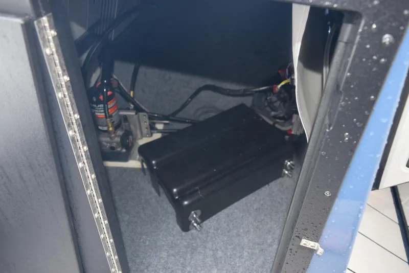 Slide: The Image of Interior view of 2023 Yamaha Boats 255XD, showcasing mechanical components and wiring. - 22