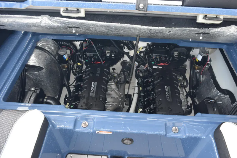 Slide: The Image of 2023 Yamaha Boats 255XD engine compartment with dual SVHO engines. - 28