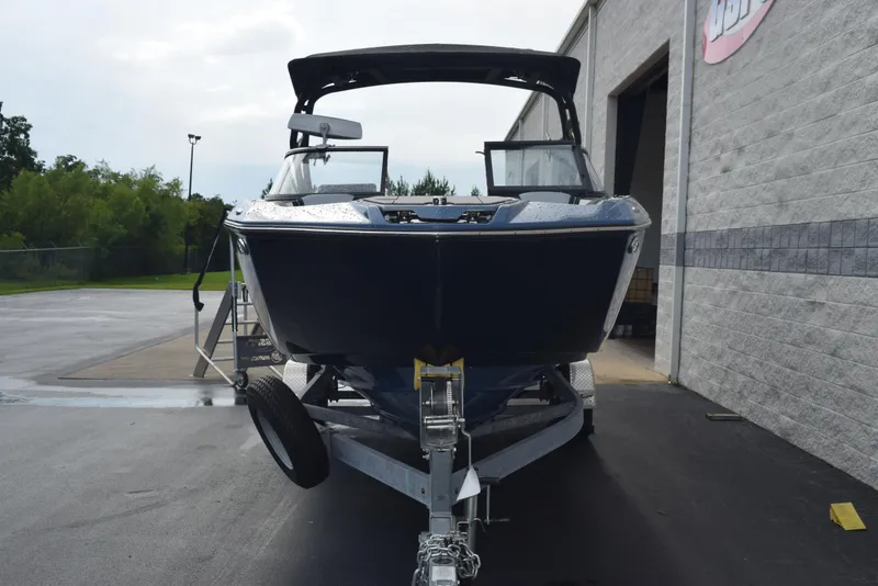 Slide: The Image of 2023 Yamaha Boats 255XD on trailer outside a building, ready for transport. - 3