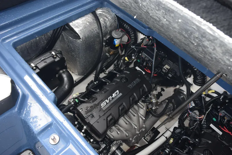 Slide: The Image of 2023 Yamaha Boats 255XD engine compartment with SVHO engine and wiring. - 30
