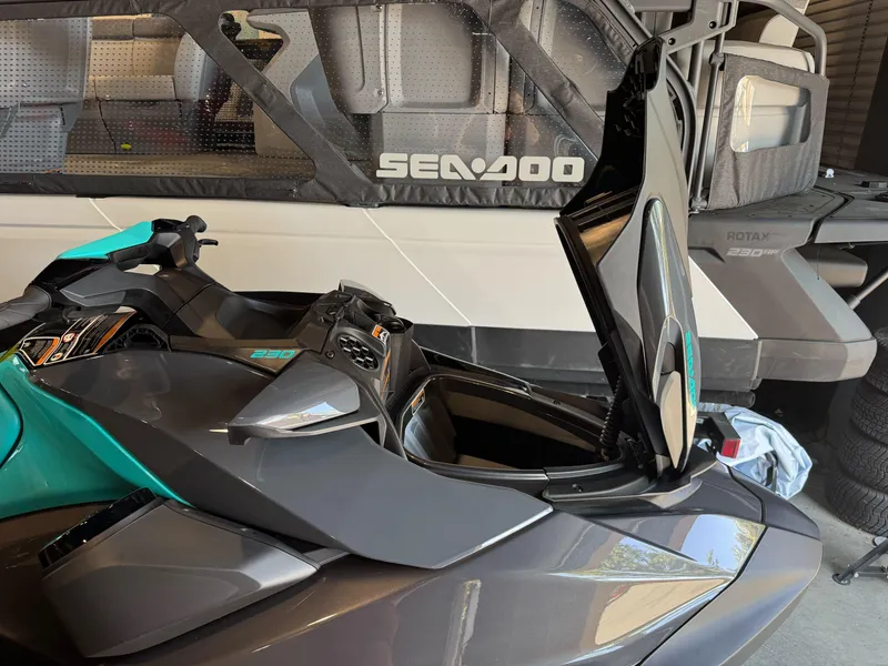 Slide: The Image of 2025 Sea-Doo GTR 230 with open storage compartment, showcasing sleek design and features. - 10