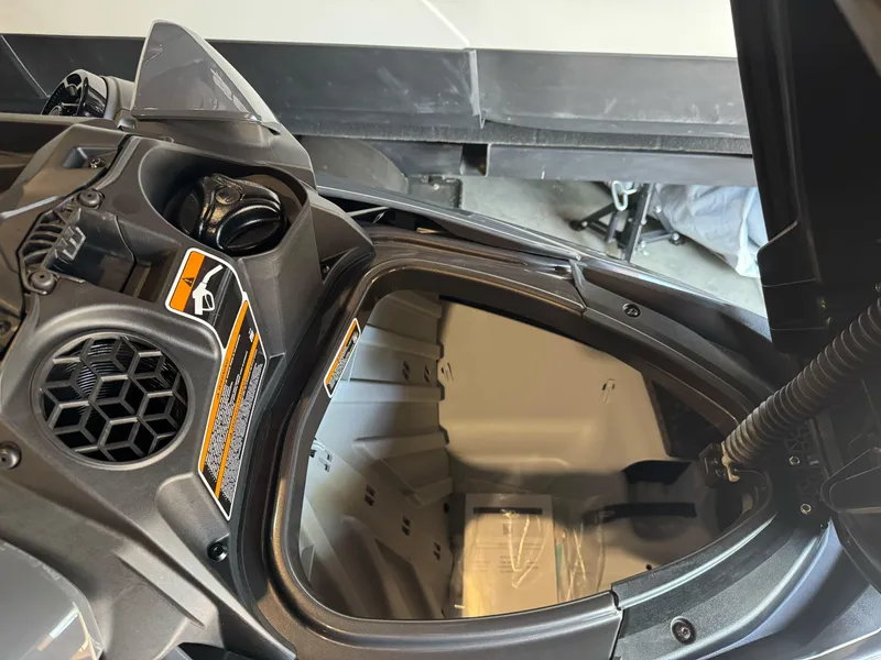 Slide: The Image of 2025 Sea-Doo GTR 230 storage compartment with detailed interior view. - 11