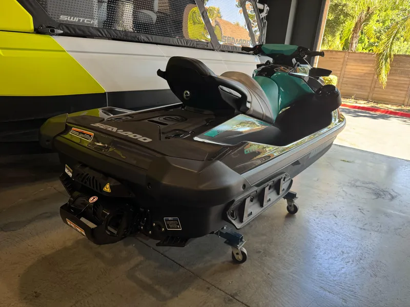 Slide: The Image of 2025 Sea-Doo GTR 230 jet ski in garage, showcasing sleek design and vibrant colors. - 4