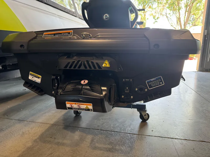 Slide: The Image of 2025 Sea-Doo GTR 230 rear view in a garage setting. - 5
