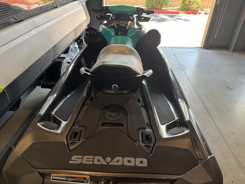 Slide: The Image of 2025 Sea-Doo GTR 230 jet ski in garage, rear view. - 6