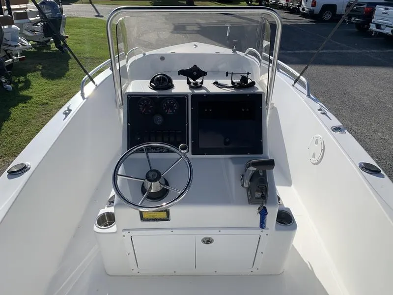 Slide: The Image of 2008 Sea King 180 CC boat console with steering wheel and controls. - 14
