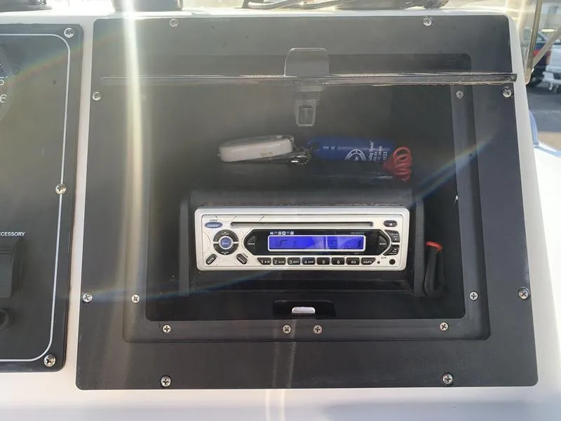 Slide: The Image of Boat dashboard with stereo system in a 2008 Sea King 180 CC. - 16