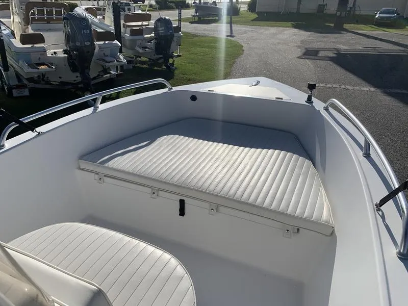 Slide: The Image of 2008 Sea King 180 CC boat interior with cushioned seating and railing. - 21