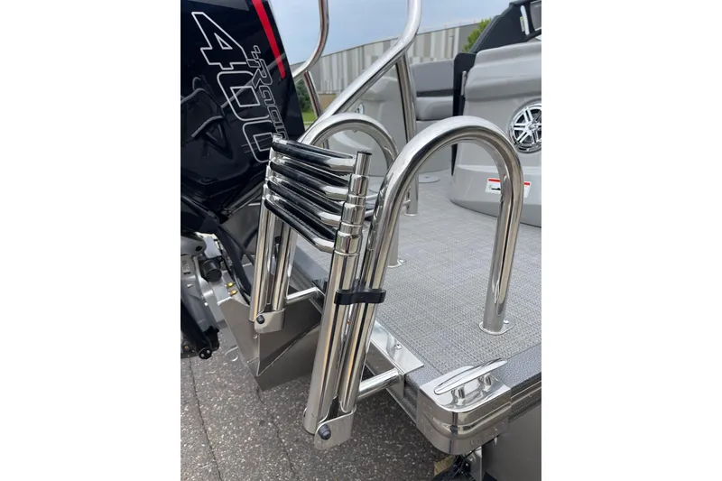 Slide: The Image of 2024 Manitou LX 25 RFXW boat ladder and engine detail. - 13
