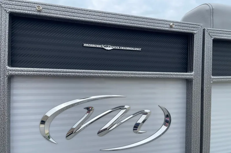 Slide: The Image of 2024 Manitou LX 25 RFXW boat with V-Toon technology logo detail. - 15