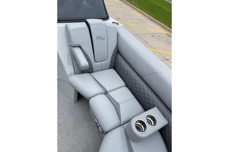 Slide: The Image of Luxurious seating in 2024 Manitou LX 25 RFXW boat with cup holders and quilted design. - 16