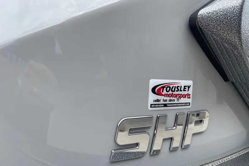 Slide: The Image of 2024 Manitou LX 25 RFXW boat with Tousley Motorsports sticker and SHP emblem. - 22