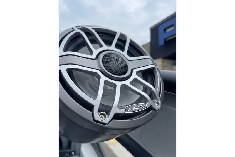 Slide: The Image of Close-up of JL Audio speaker on 2024 Manitou LX 25 RFXW boat. - 23
