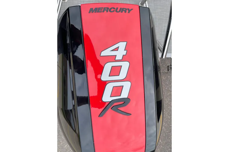 Slide: The Image of Red and black Mercury 400R engine on 2024 Manitou LX 25 RFXW boat. - 4