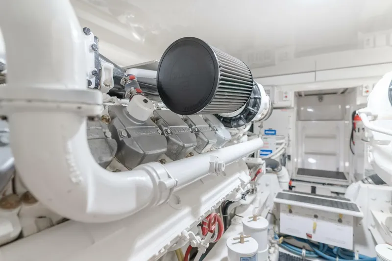 Slide: The Image of Engine room of 2008 Viking 52 Sport Coupe, showcasing detailed mechanical components. - 21