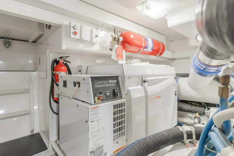 Slide: The Image of Engine room of 2008 Viking 52 Sport Coupe with Cummins Onan marine generator. - 23