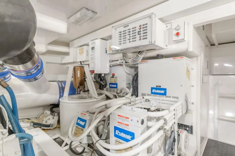 Slide: The Image of Engine room of 2008 Viking 52 Sport Coupe with mechanical equipment and control panels. - 24