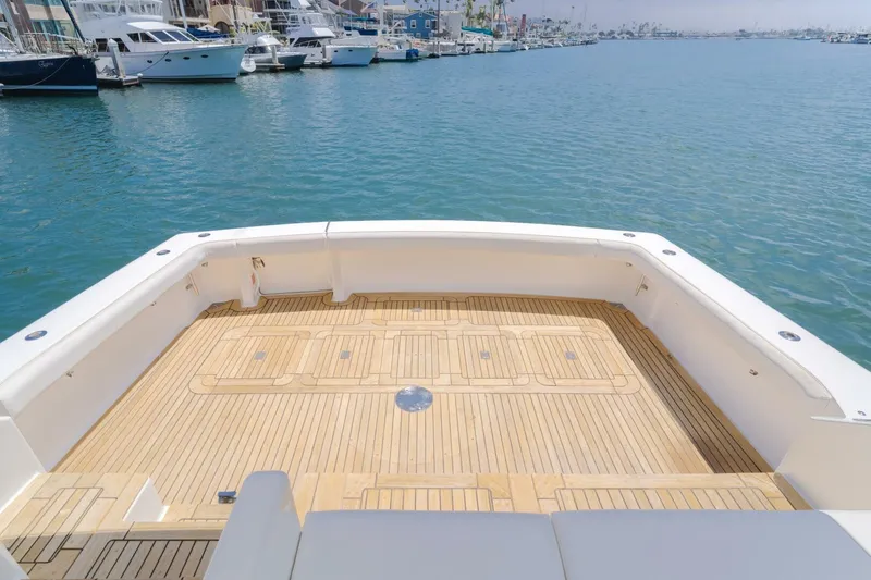 Slide: The Image of Spacious deck of 2008 Viking 52 Sport Coupe yacht in marina setting. - 26