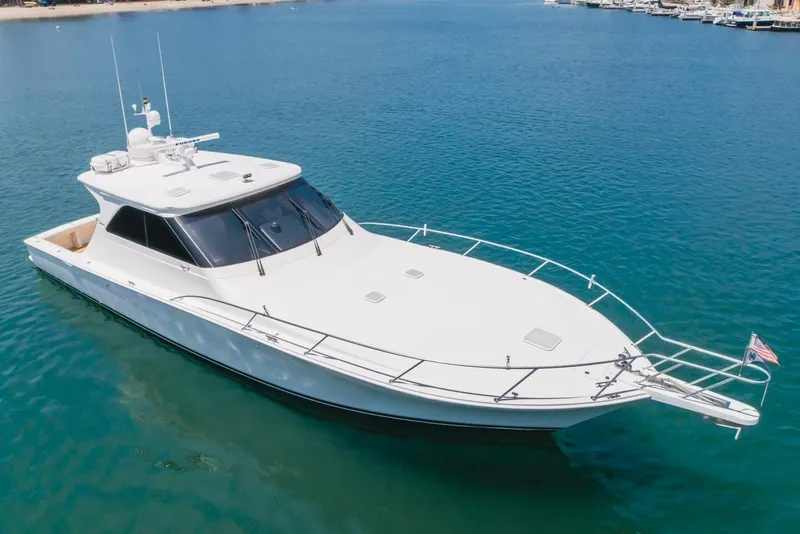 Slide: The Image of 2008 Viking 52 Sport Coupe yacht on calm blue water, aerial view. - 34