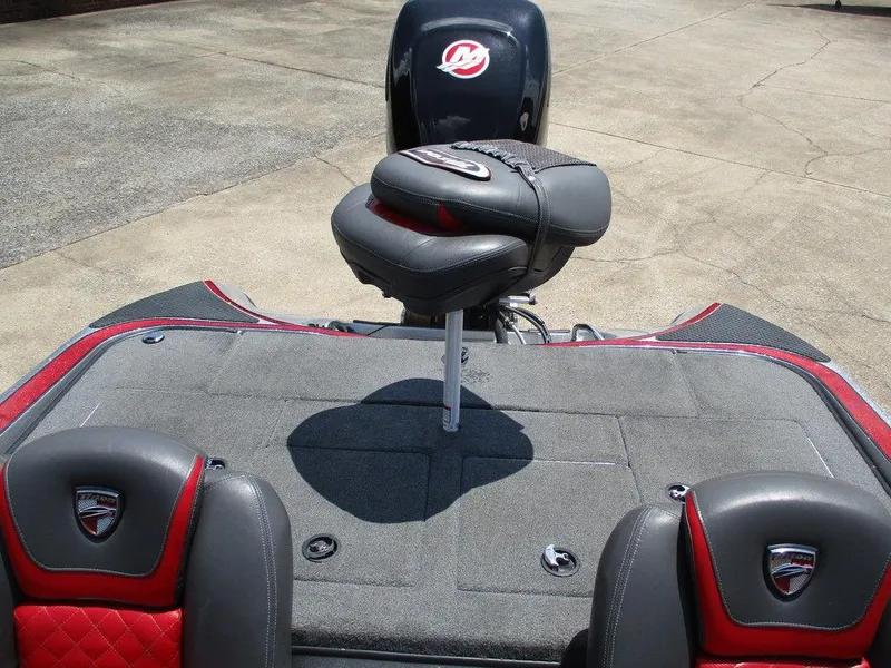 Slide: The Image of 2016 Triton 18 TrX boat interior with cushioned seating and storage compartments. - 3
