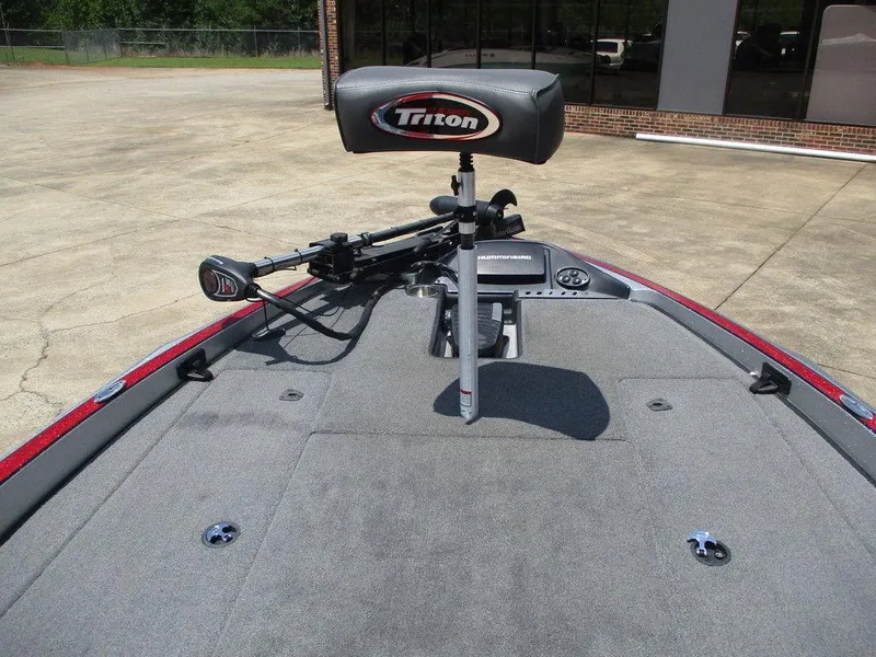 Slide: The Image of 2016 Triton 18 TrX boat deck with seat and trolling motor. - 8