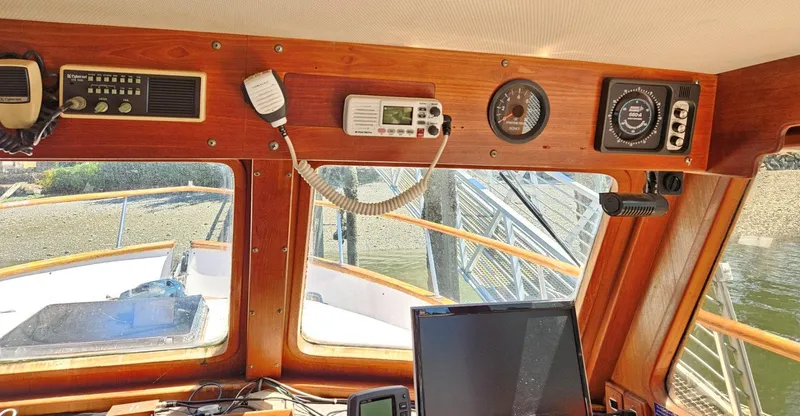 Slide: The Image of Interior view of 1981 Ocean Double Cabin Trawler's helm with navigation equipment. - 6