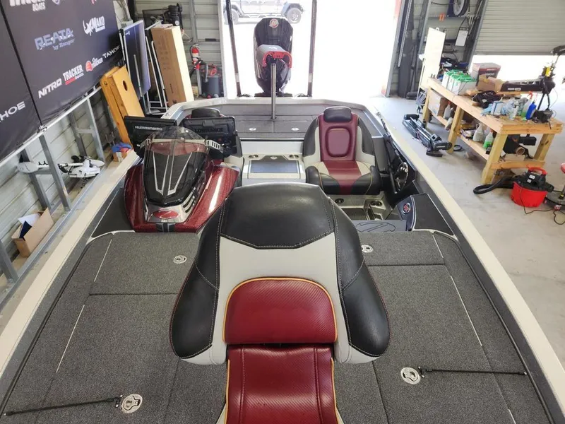 Slide: The Image of 2021 Ranger Z521C Ranger Cup Equipped boat interior in a garage setting. - 5