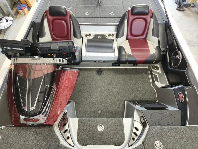Slide: The Image of 2021 Ranger Z521C Ranger Cup boat interior with dual seats and advanced navigation equipment. - 7