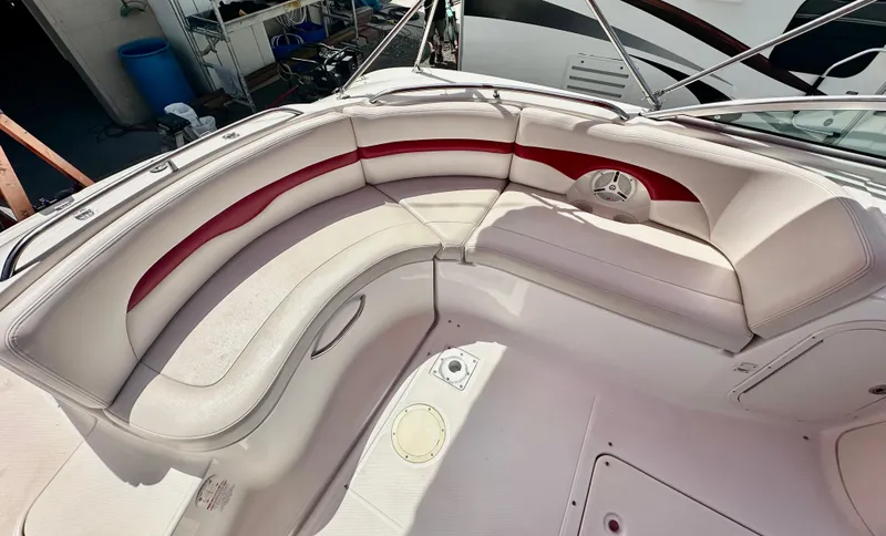 Slide: The Image of 2003 Chaparral 223 Sunesta boat interior with white and red seating. - 7