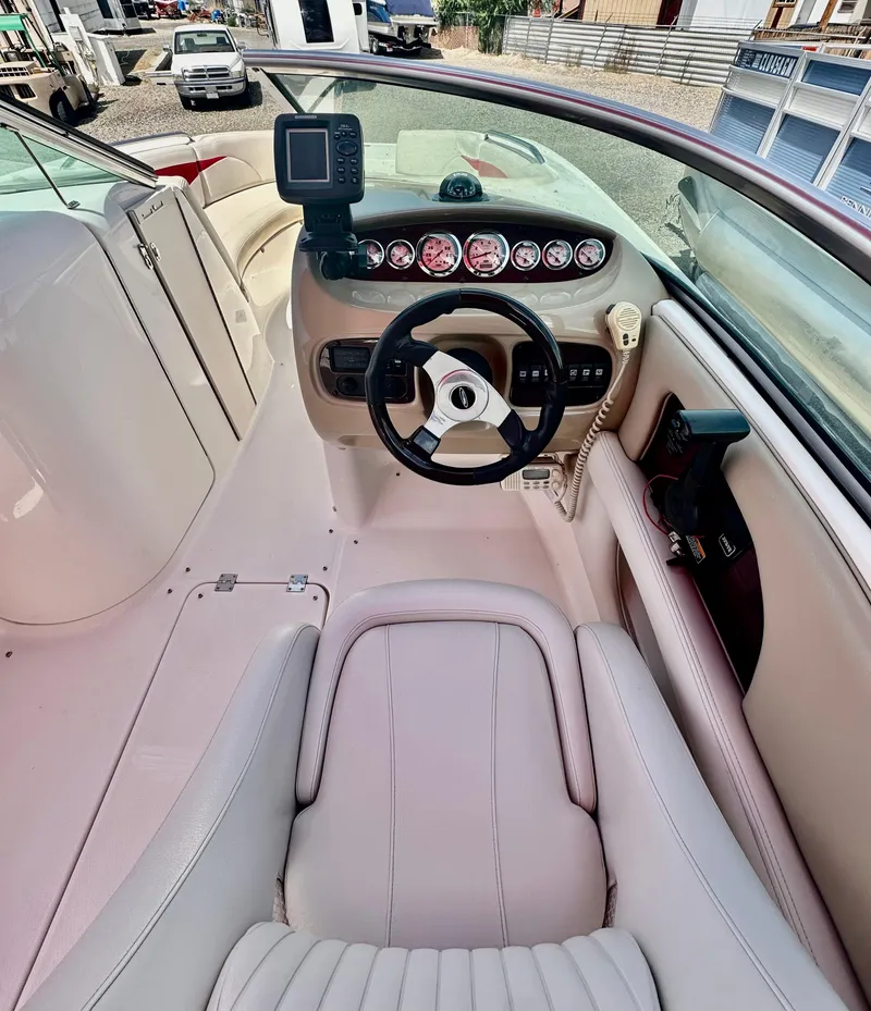 Slide: The Image of 2003 Chaparral 223 Sunesta boat cockpit with steering wheel and instrument panel. - 8